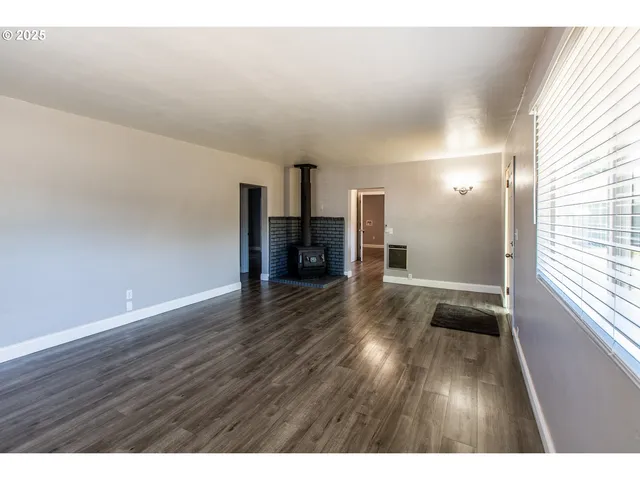 a view of a livingroom with wooden floor