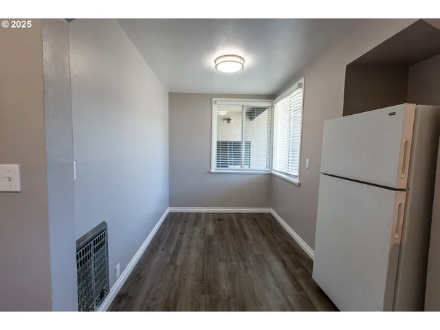 a view of wooden floor in an empty room
