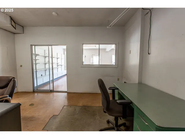 a view of an empty room and window