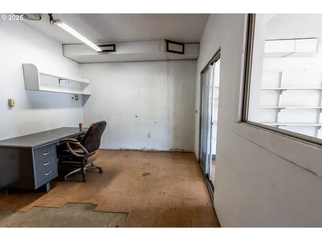 a view of a workspace with furniture