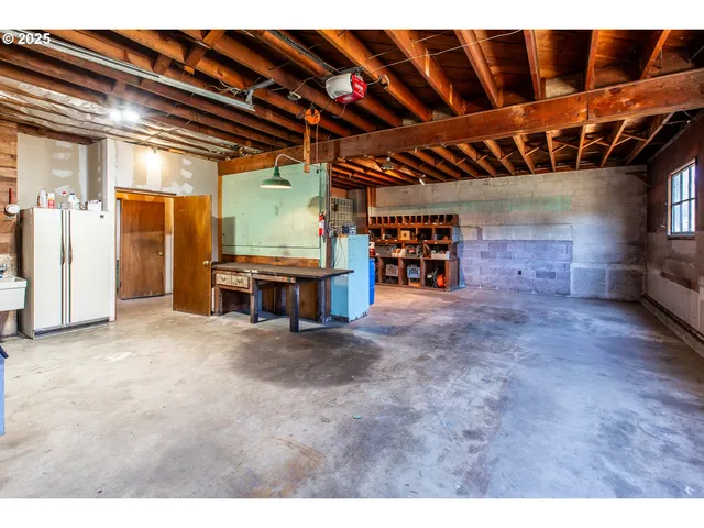 a view of a room with wooden ceiling