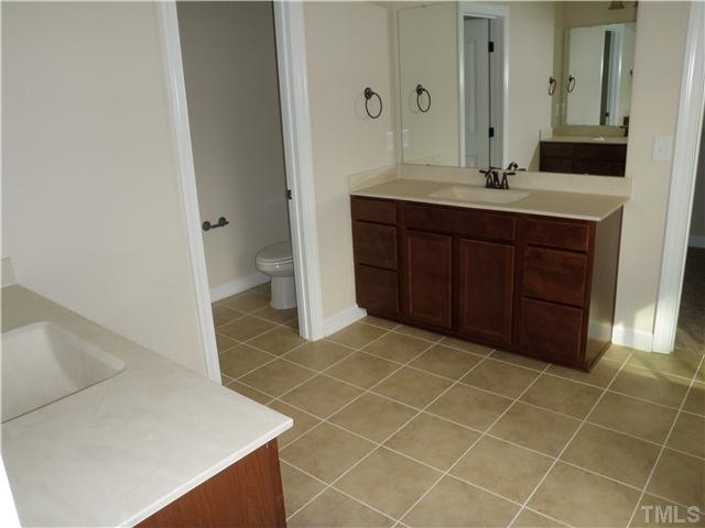 4854 Inwood Road Raleigh, NC 27603 - Photo 12 of 20 Deluxe master bath with dual raised vanities, tile floors, dual flush toilets and upgraded rectangular bowls.