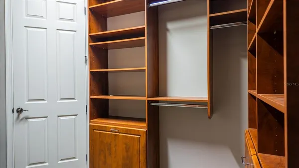 a spacious bathroom with a tub sink and mirror