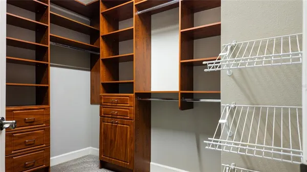 a bathroom with a tub shower and window