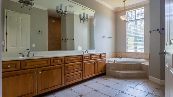 a bathroom with a sink and mirror