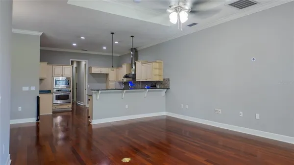 an empty room with closet and a bathroom