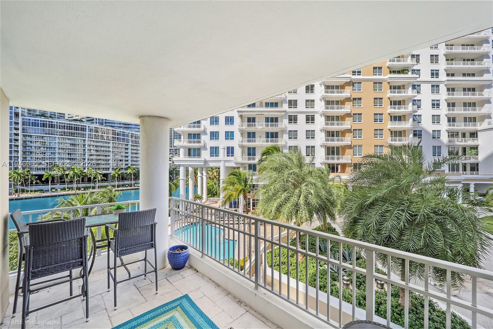 701 Brickell Key Boulevard, Unit 404 Miami, FL 33131 - Photo 12 of 12 a view of a balcony with chairs