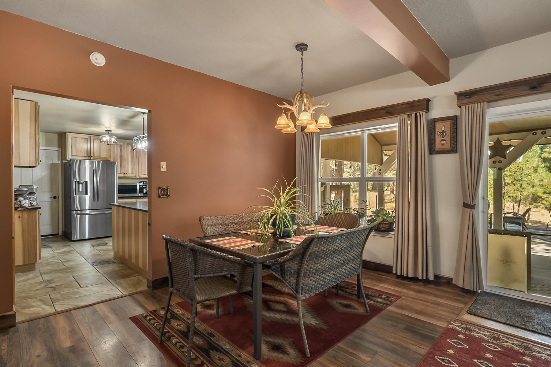 15730 Jackpine Road La Pine, OR 97739 - Photo 13 of 43 a view of a dining room with furniture and a chandelier
