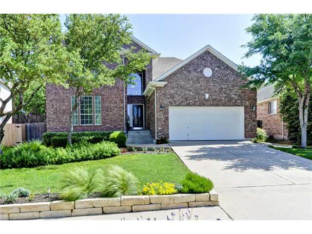 2748 Grimes Ranch Road Austin, TX 78732 - Photo 1 of 1 a front view of a house with a yard and garage