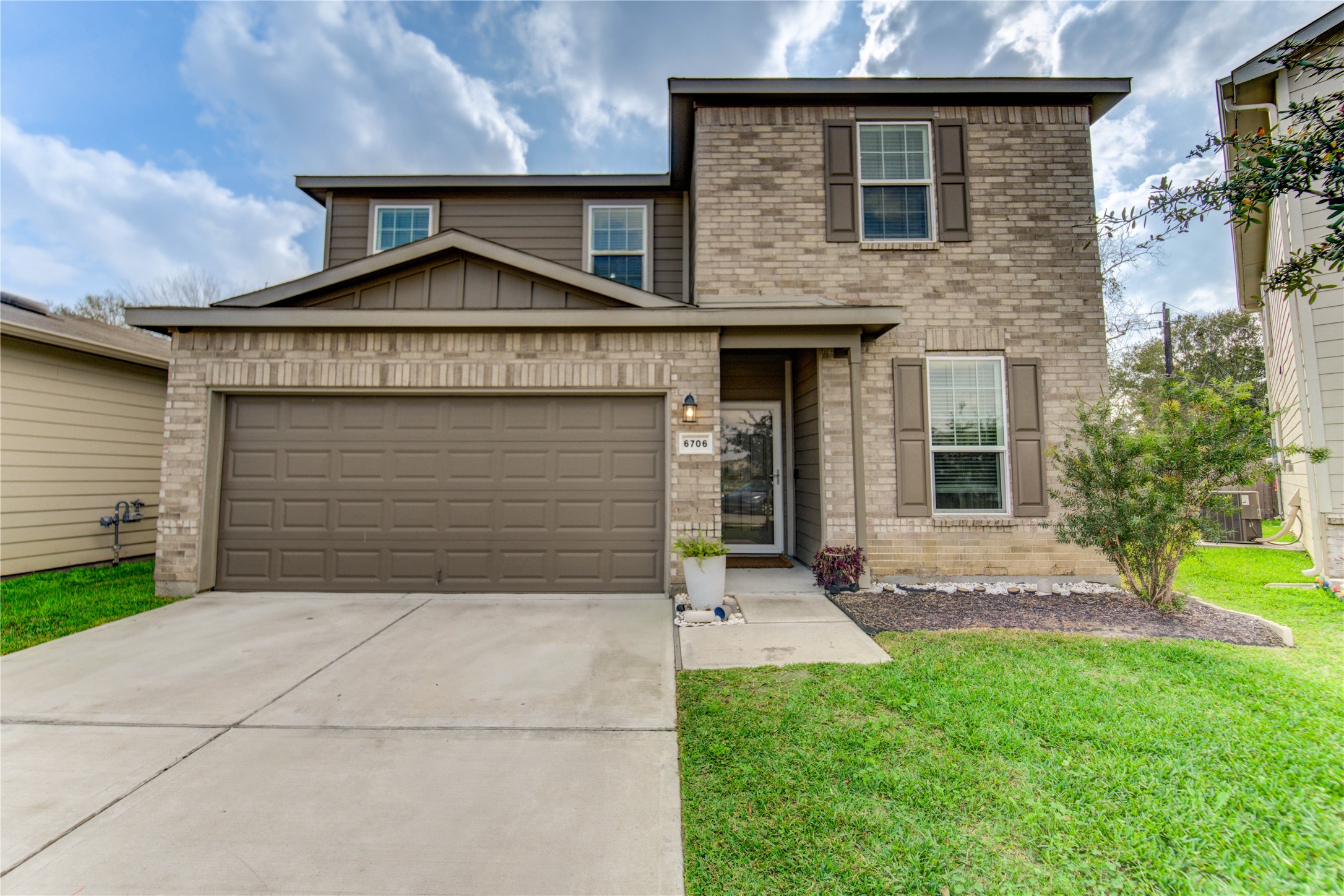 6706 Hobby Wind Ridge Drive Houston, TX 77075 - Photo 1 of 31 a front view of a house with a yard and garage