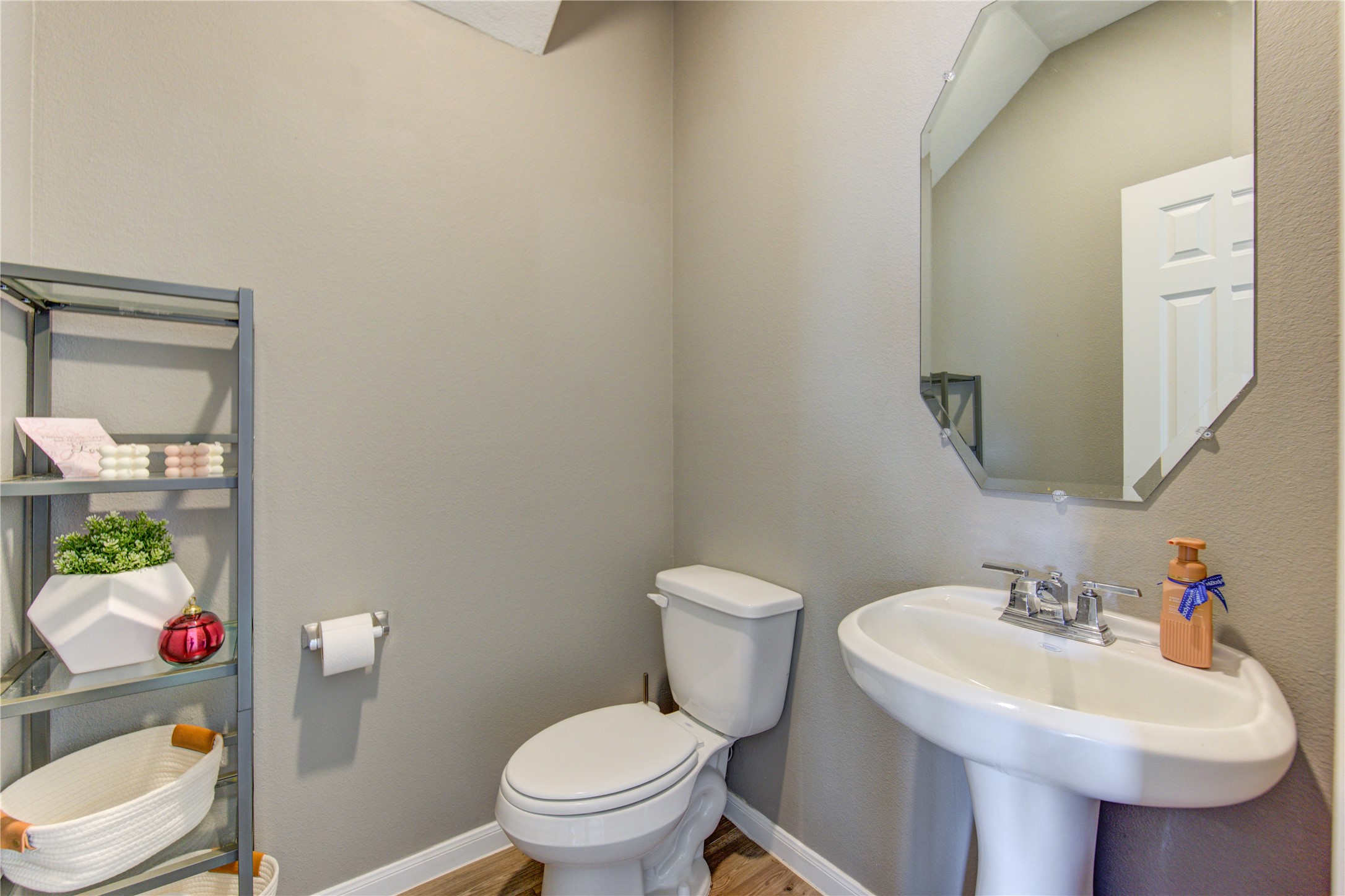 6706 Hobby Wind Ridge Drive Houston, TX 77075 - Photo 13 of 31 a white toilet sitting next to a bathroom sink