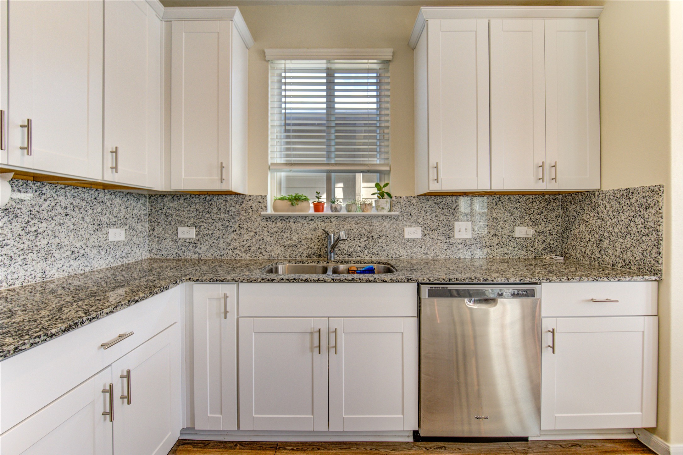 6706 Hobby Wind Ridge Drive Houston, TX 77075 - Photo 20 of 31 a kitchen with granite countertop white cabinets and sink