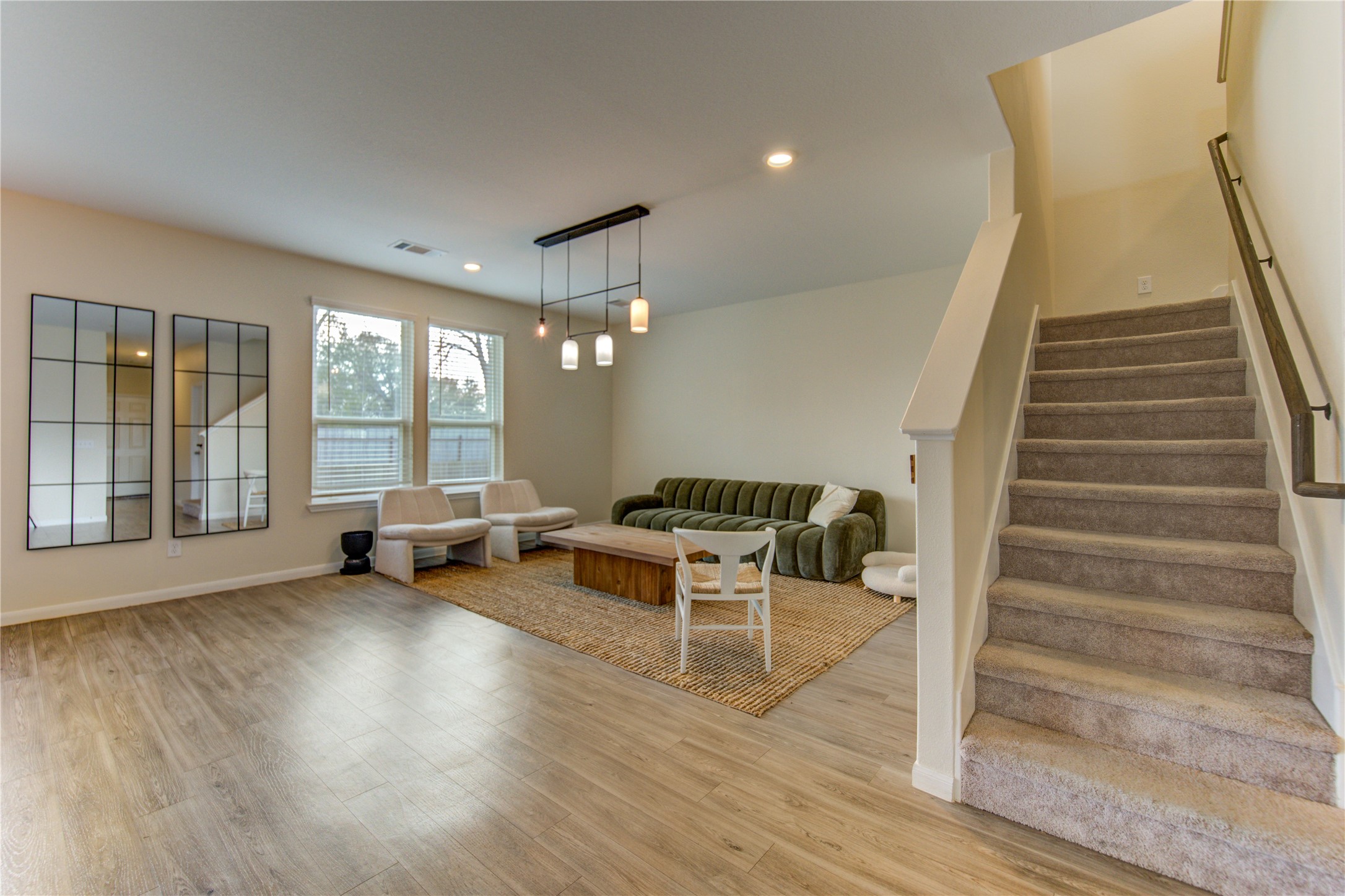 6706 Hobby Wind Ridge Drive Houston, TX 77075 - Photo 22 of 31 a living room with furniture and a floor to ceiling window