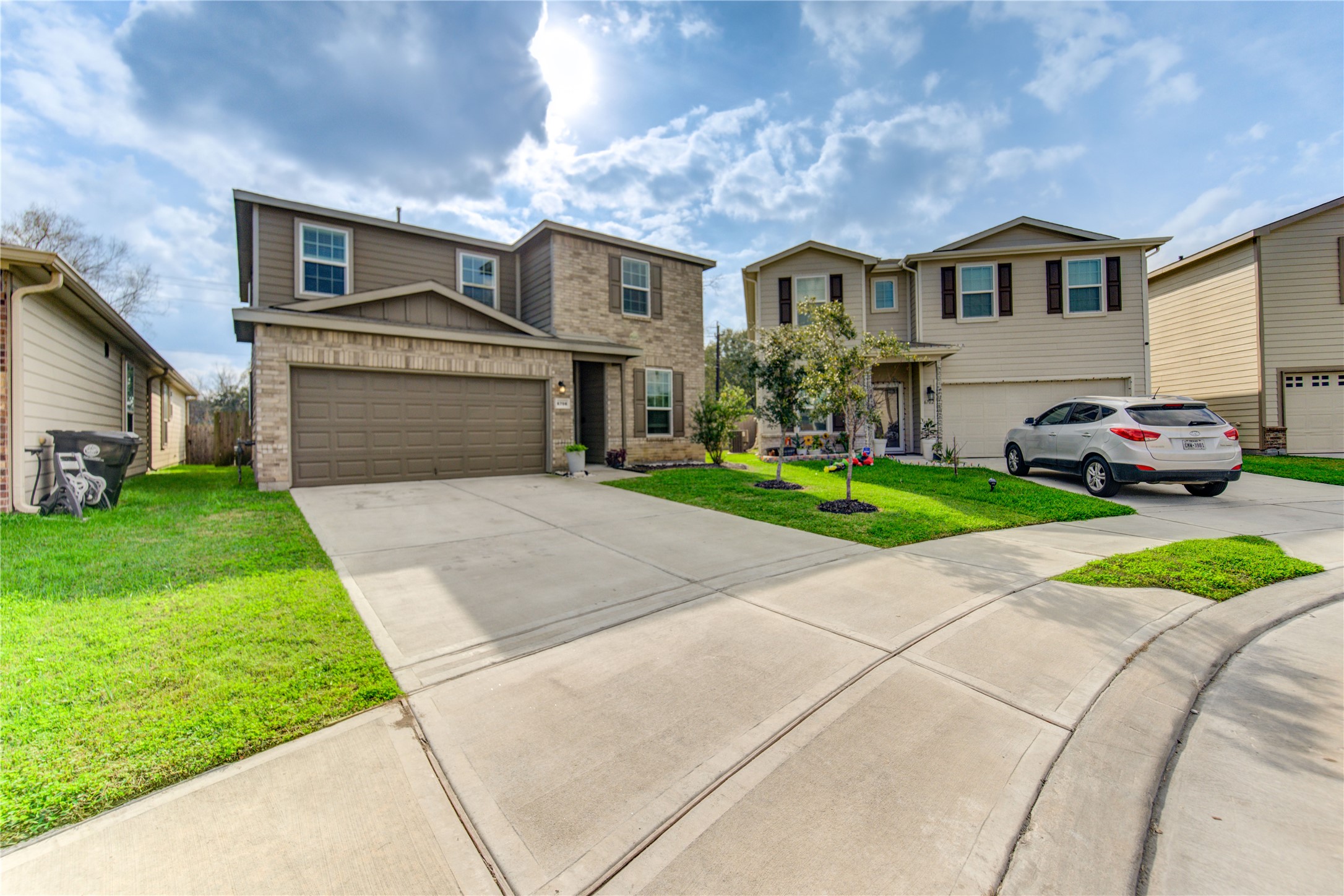 6706 Hobby Wind Ridge Drive Houston, TX 77075 - Photo 4 of 31 a front view of a house with a yard and garage