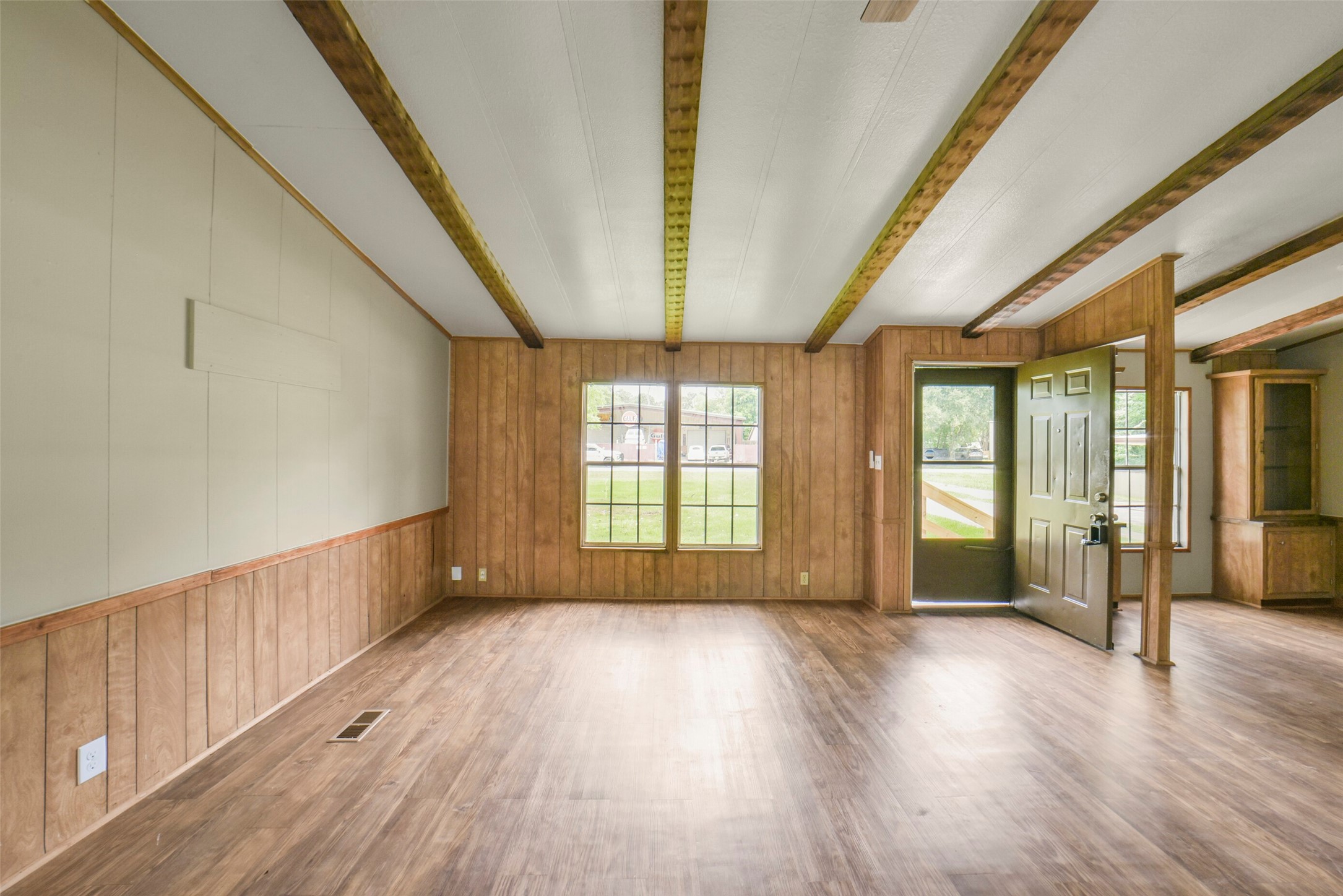 11023 Forrest Valley Drive Houston, TX 77065 - Photo 8 of 47 a view of an empty room with wooden floor and a window