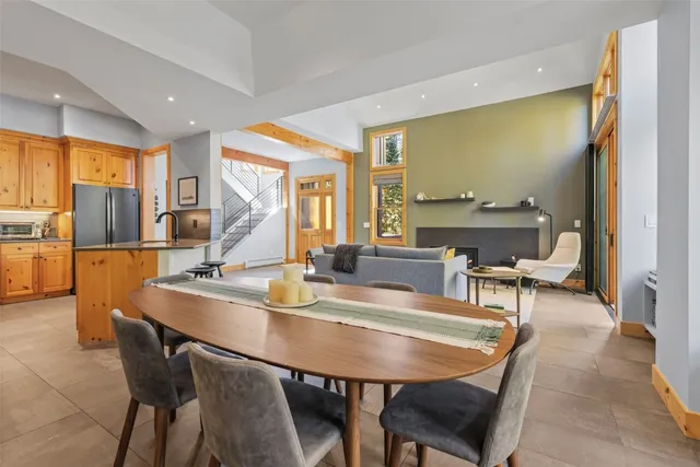 a dining room with furniture and wooden floor