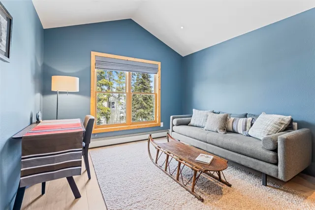 a view of a brick house with large windows