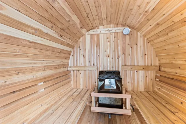 a kitchen with a stove and a wooden floor