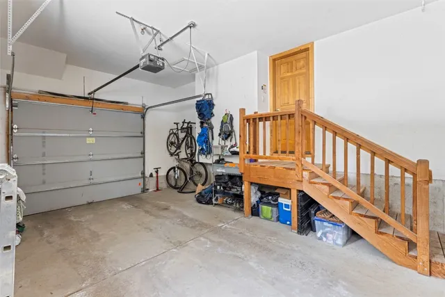 a view of a garage with rack and bicycle