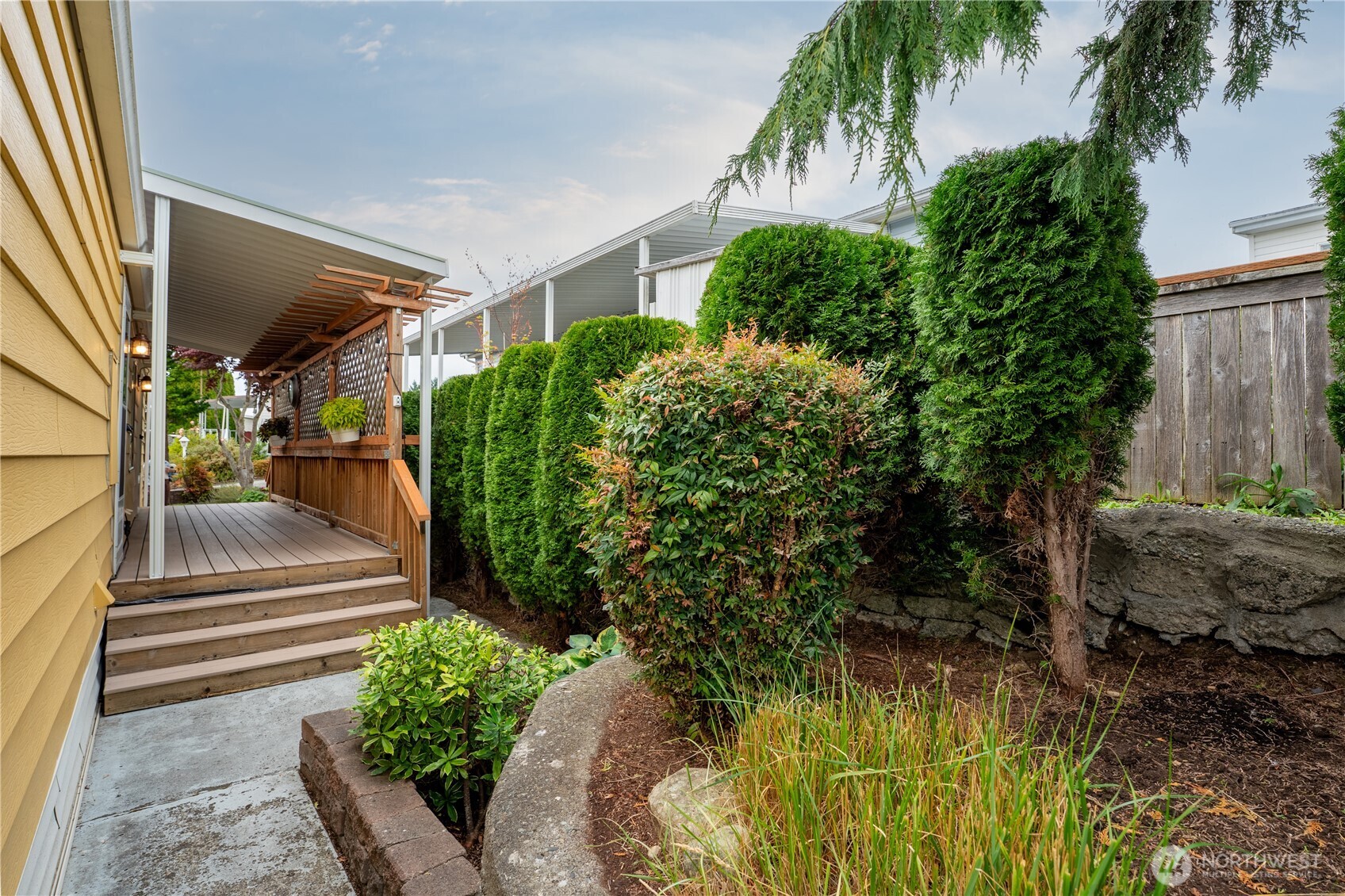1415 84th Street Southeast, Unit 54 Everett, WA 98208 - Photo 11 of 19 a view of a house with a yard