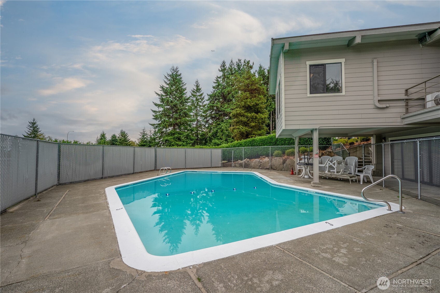 1415 84th Street Southeast, Unit 54 Everett, WA 98208 - Photo 16 of 19 a view of a swimming pool with a patio