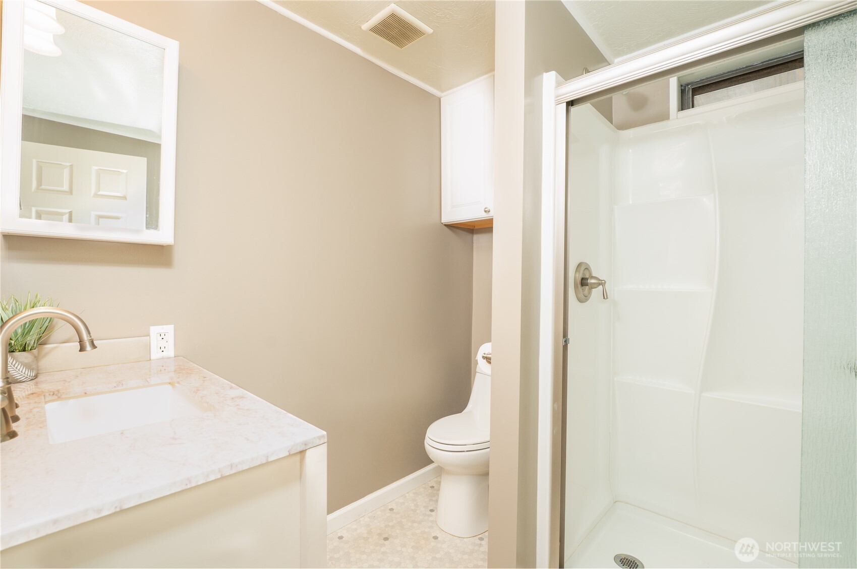 1415 84th Street Southeast, Unit 54 Everett, WA 98208 - Photo 7 of 19 a bathroom with a sink a toilet and shower