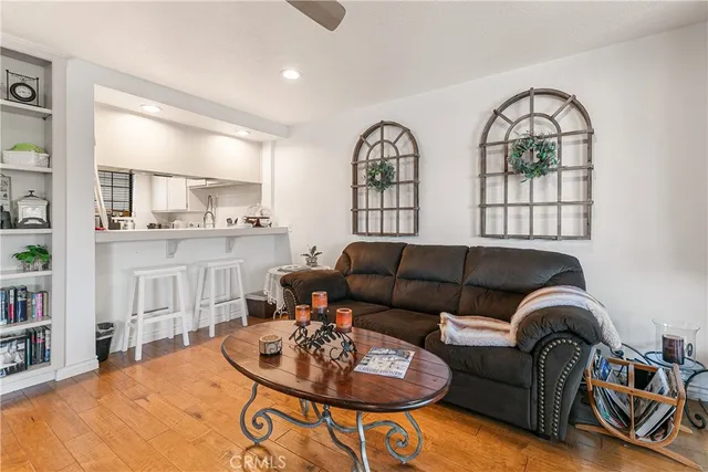 a living room with furniture fireplace and a window