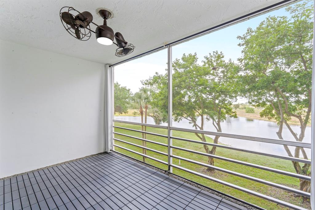 a view of a porch and wooden floor