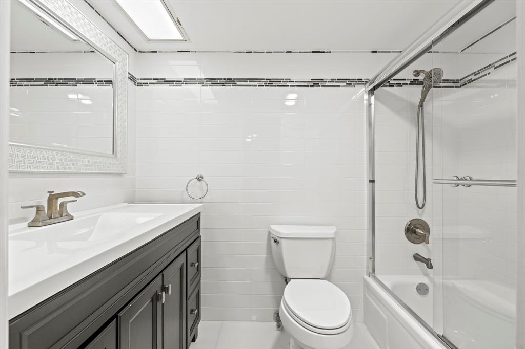 3090 North Course Drive, Unit 309 Pompano Beach, FL 33069 - Photo 12 of 21 a bathroom with a sink a toilet and shower