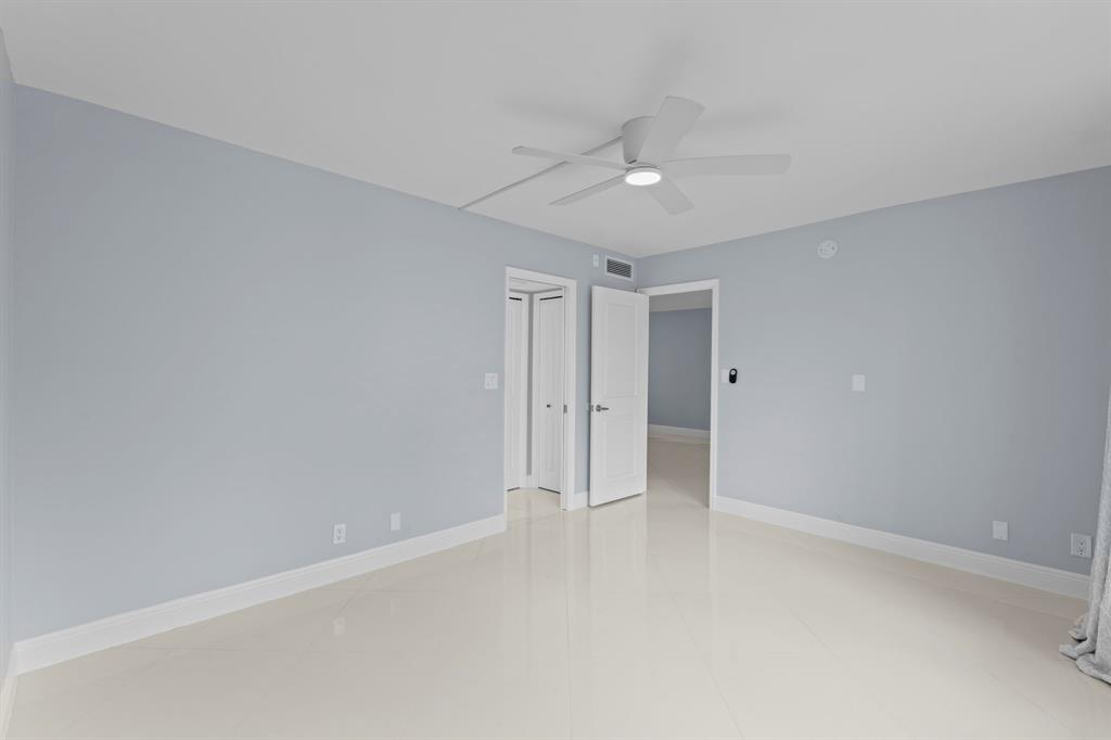 3090 North Course Drive, Unit 309 Pompano Beach, FL 33069 - Photo 15 of 21 wooden floor in an empty room