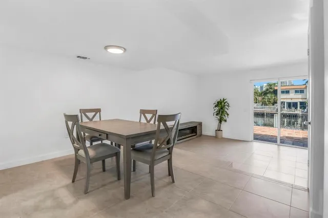 a view of a dining room with furniture and window