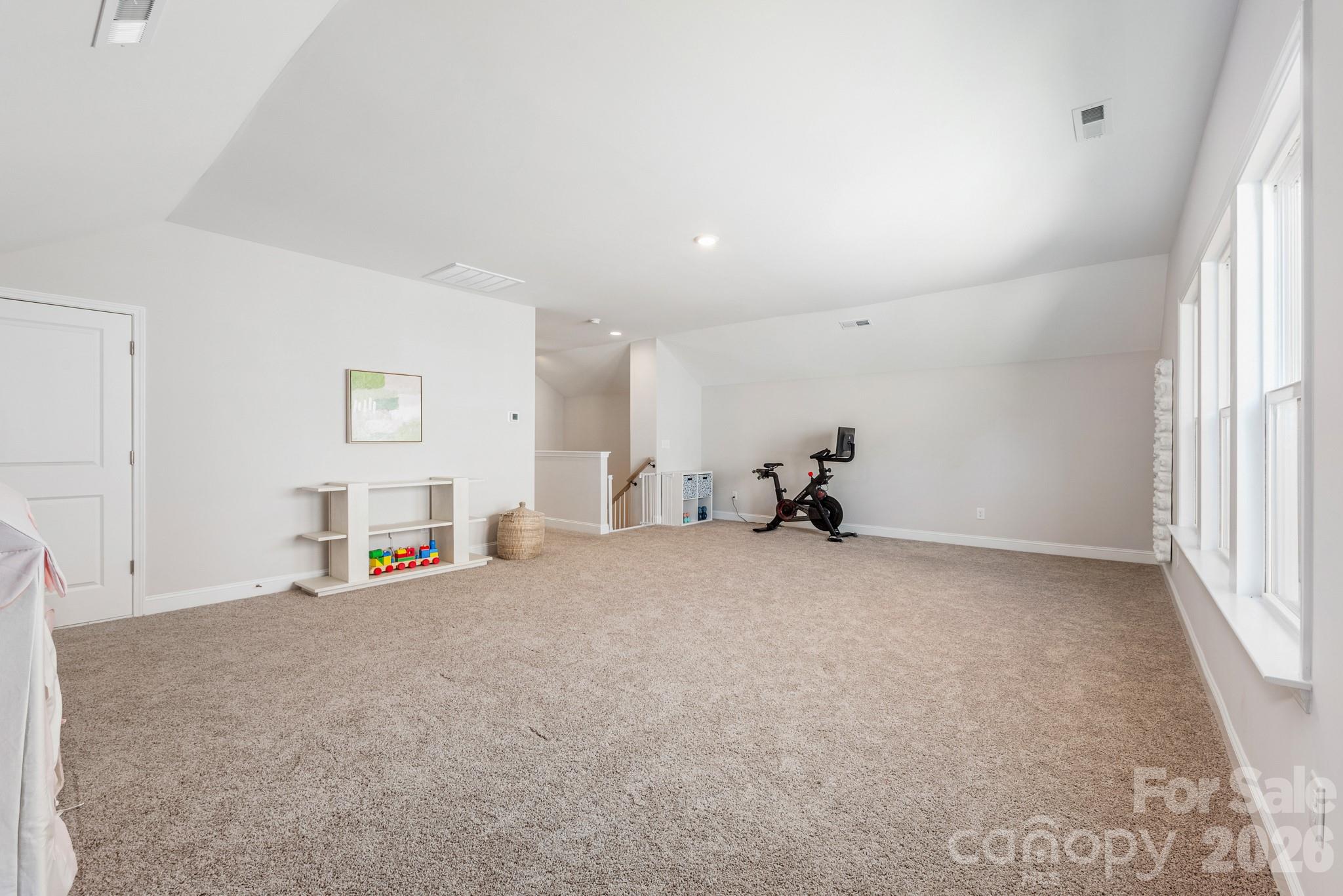 17210 Sand Bank Road Charlotte, NC 28278 - Photo 13 of 20 an empty room with furniture and a window