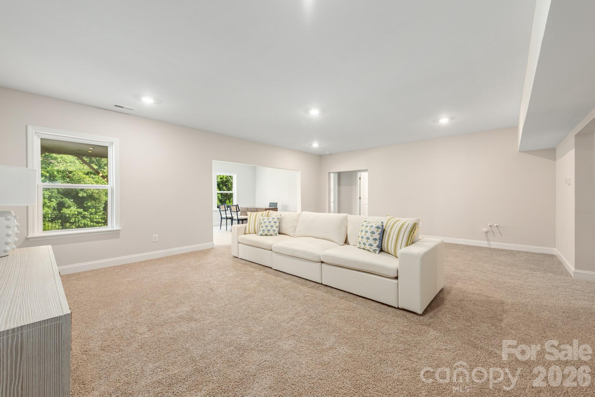 17210 Sand Bank Road Charlotte, NC 28278 - Photo 16 of 20 a living room with furniture and a large window