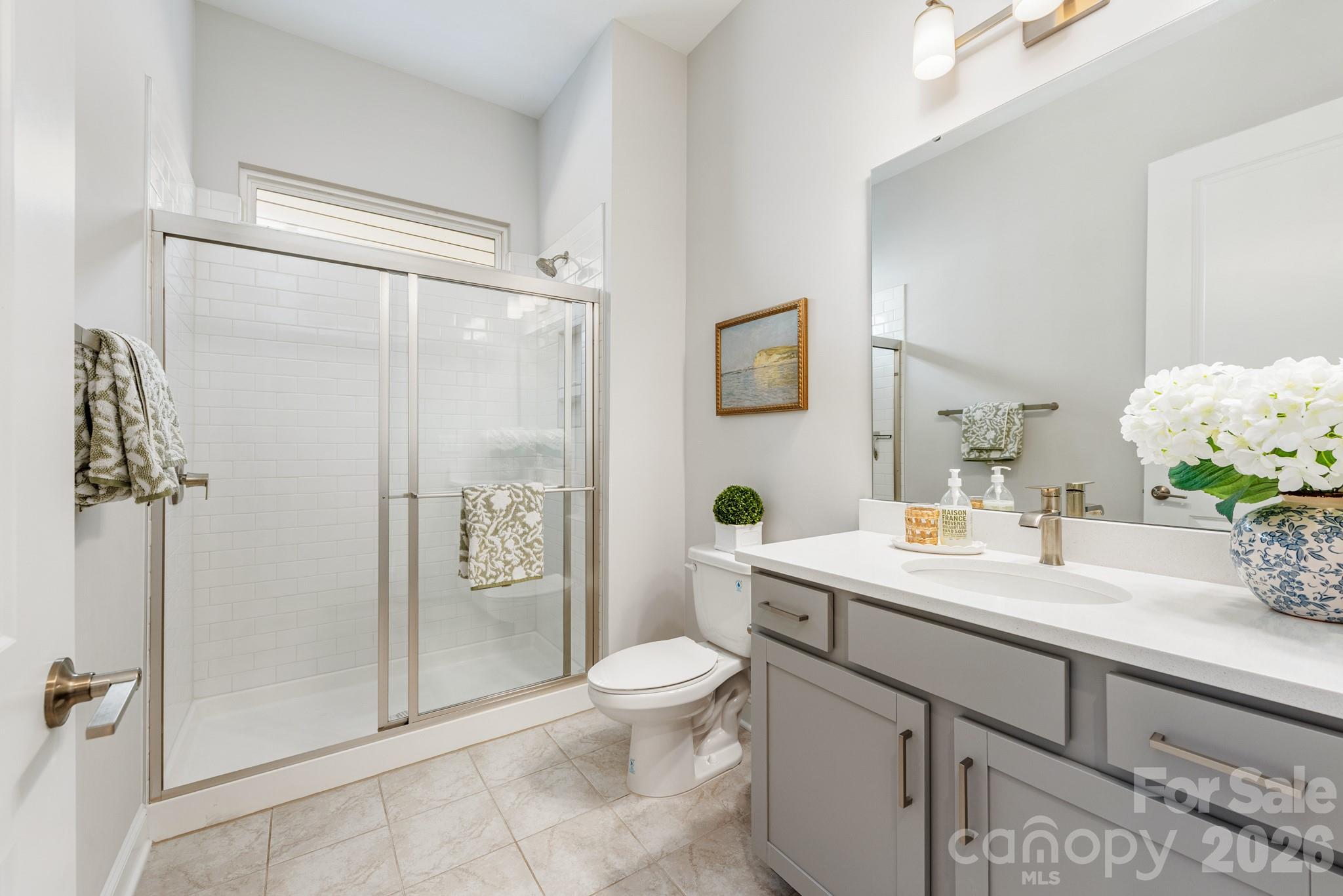 17210 Sand Bank Road Charlotte, NC 28278 - Photo 17 of 20 a bathroom with a sink a toilet and shower