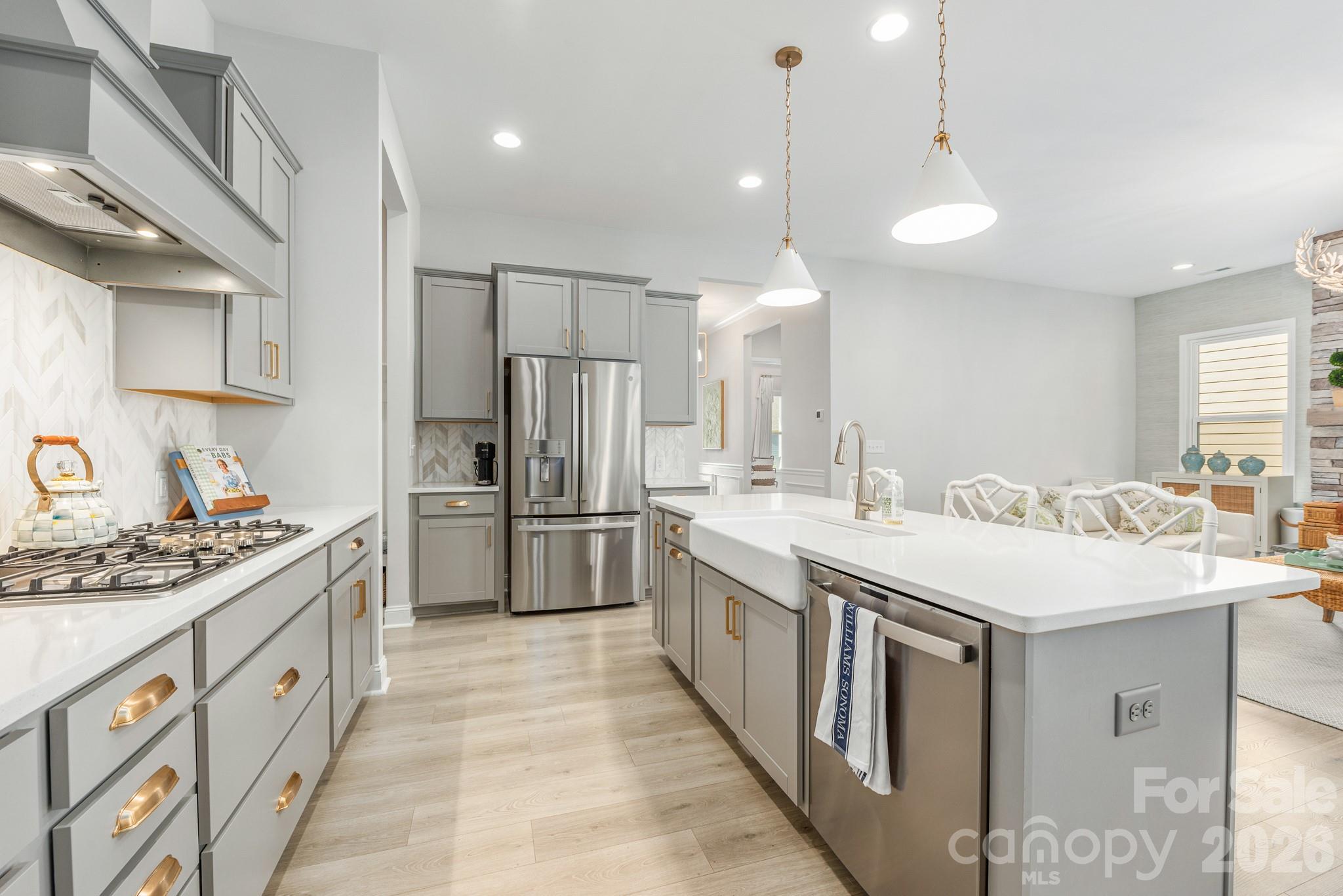 17210 Sand Bank Road Charlotte, NC 28278 - Photo 4 of 20 a kitchen with stainless steel appliances a sink stove and refrigerator