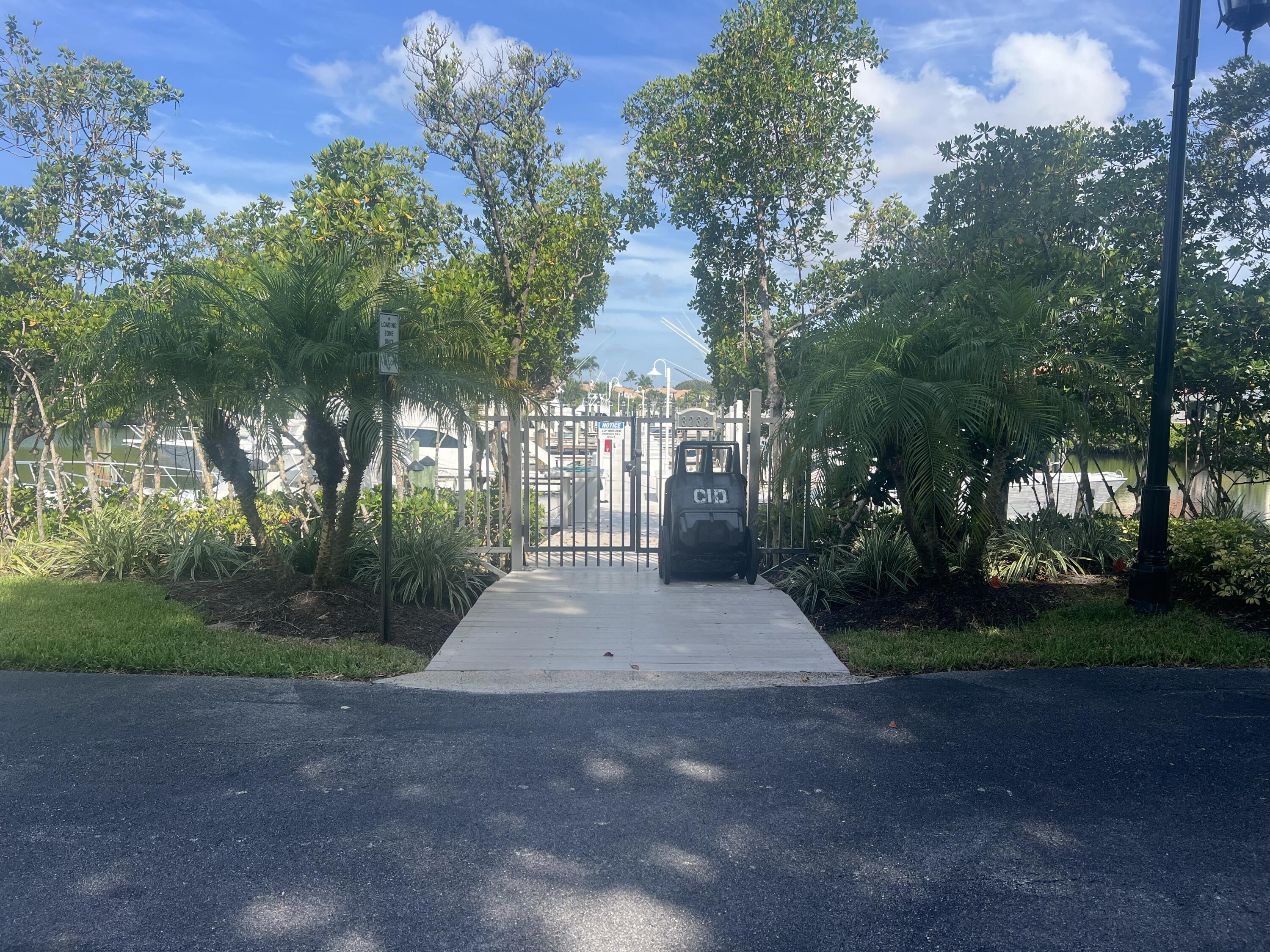 3232 Casseekey Island Road, Unit 7N Jupiter, FL 33477 - Photo 6 of 8 a view of a street with a houses