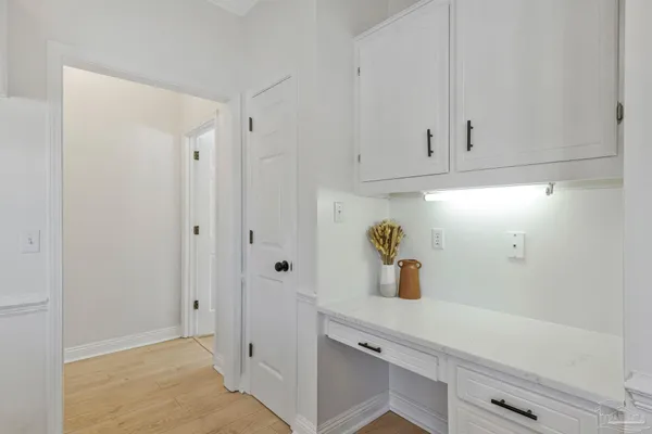 a kitchen with kitchen island a sink stainless steel appliances and cabinets