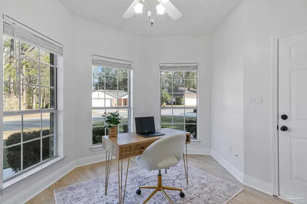 a living room with furniture and a window