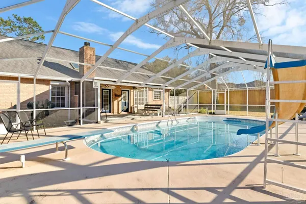 a view of a swimming pool with a patio
