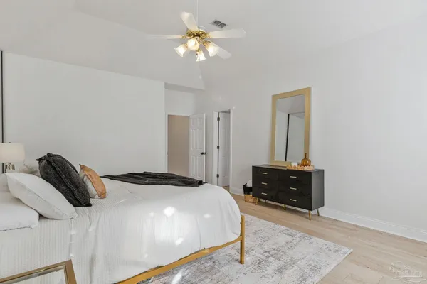 a bathroom with double sink and a mirror