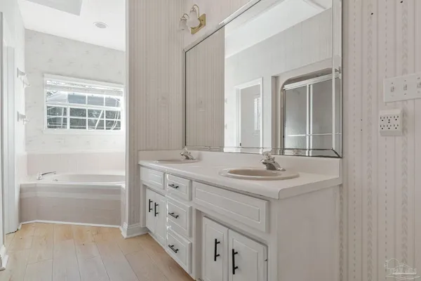 a bathroom with a glass shower door