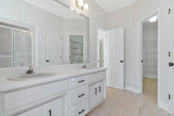 a white bath tub sitting next to a window