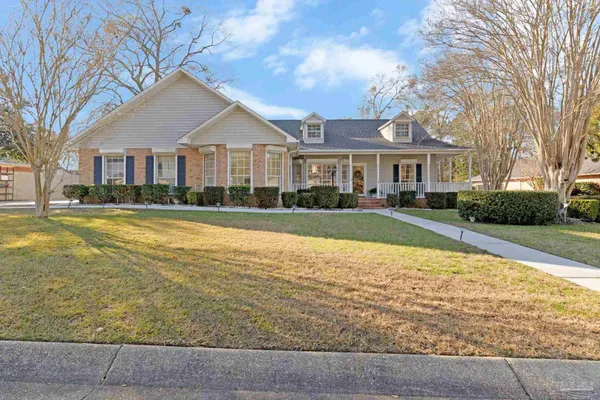 a view of a chairs and table in the patio