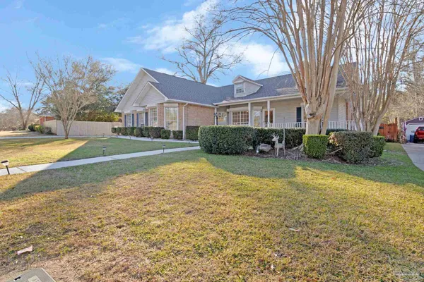 a front view of a house with garden