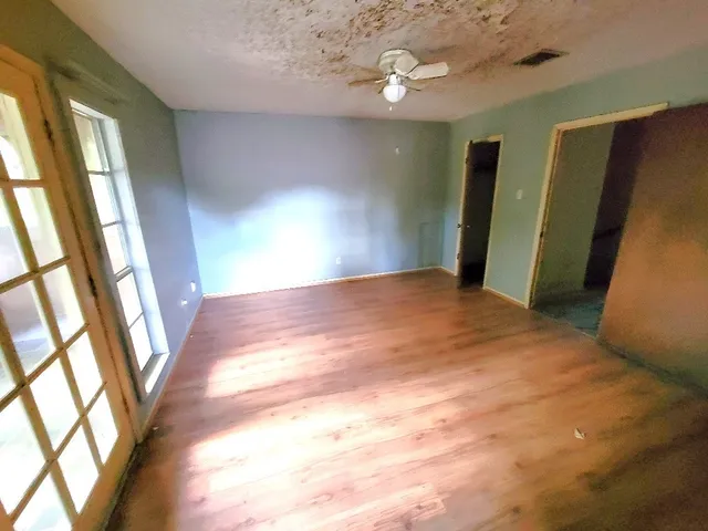 a view of an empty room with a window