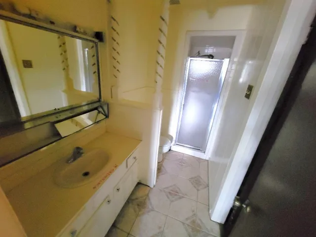 a bathroom with a tub and shower