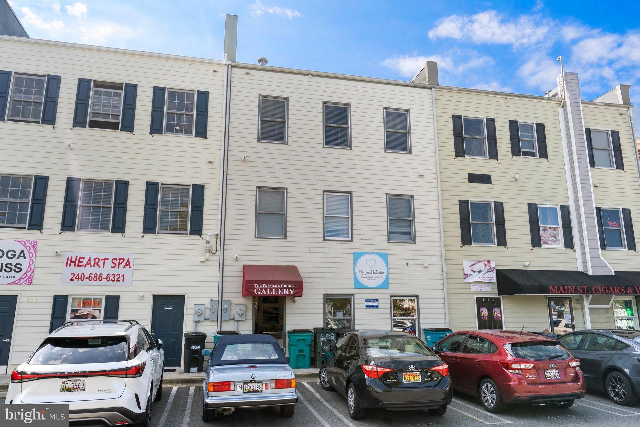 402 Main Street, Unit 300 Gaithersburg, MD 20878 - Photo 19 of 30 a car parked in front of a building