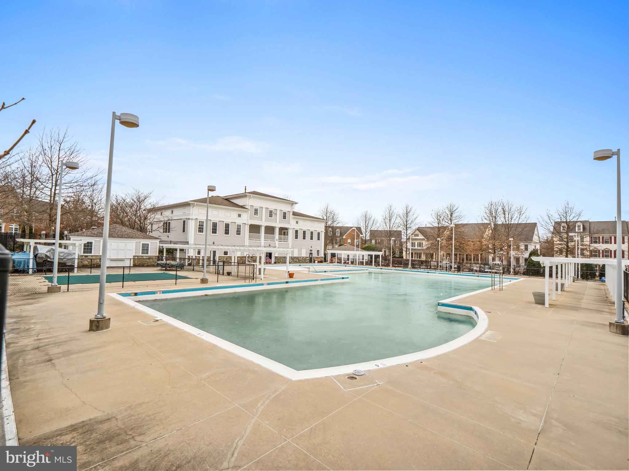 402 Main Street, Unit 300 Gaithersburg, MD 20878 - Photo 25 of 30 a view of a swimming pool with outdoor seating