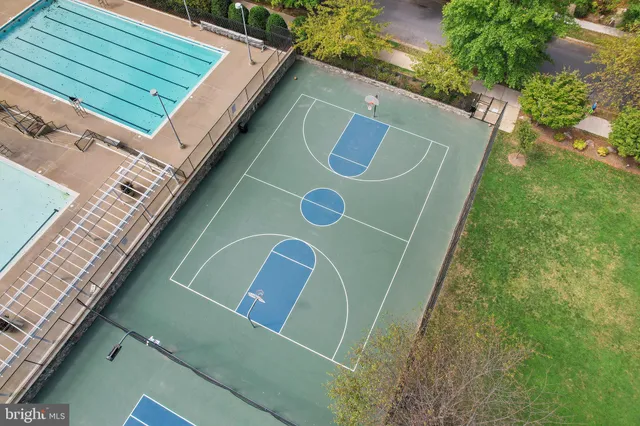 a green field with next to a road