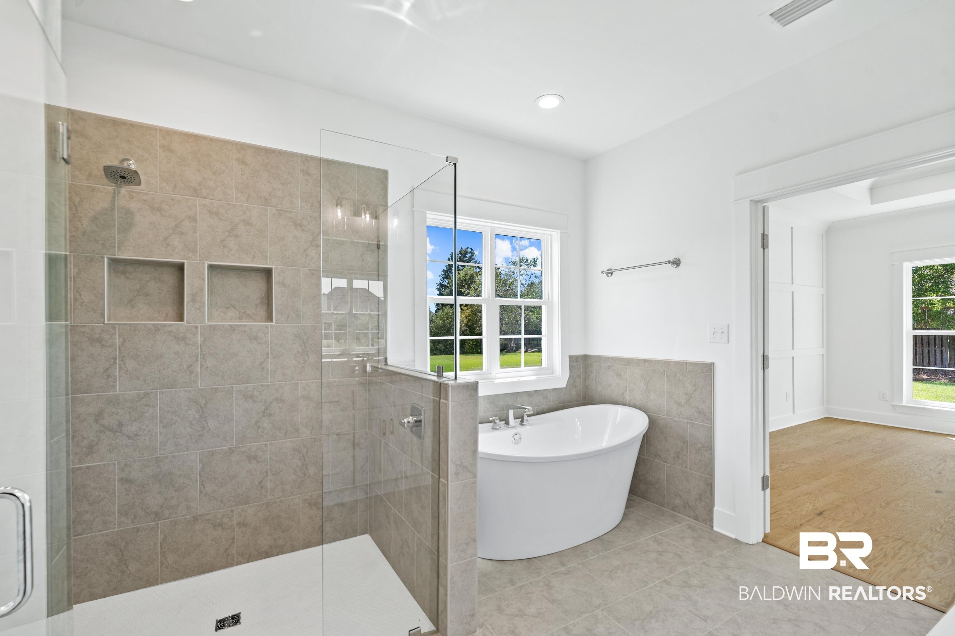 25927 Capra Court Daphne, AL 36526 - Photo 20 of 37 Bathroom with plus walk in shower and hardwood / wood-style floors